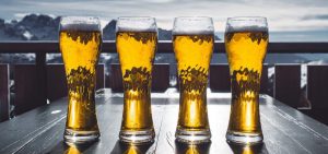 Line of beer glasses on a table