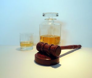 gavel with alcohol - law